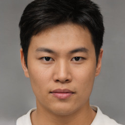 Neutral asian young-adult male with short  brown hair and brown eyes