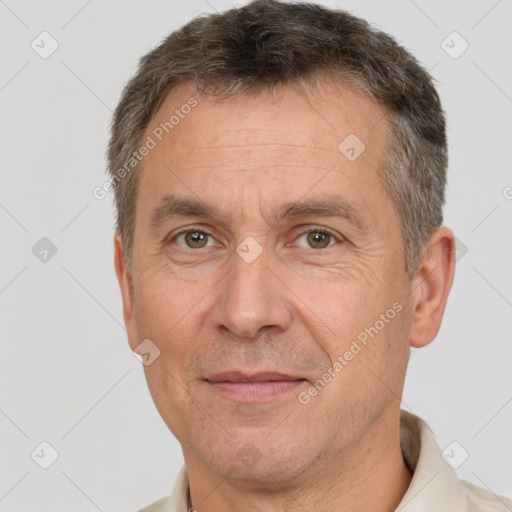 Joyful white middle-aged male with short  brown hair and brown eyes