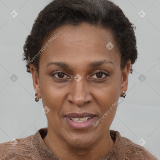 Joyful black adult female with short  brown hair and brown eyes