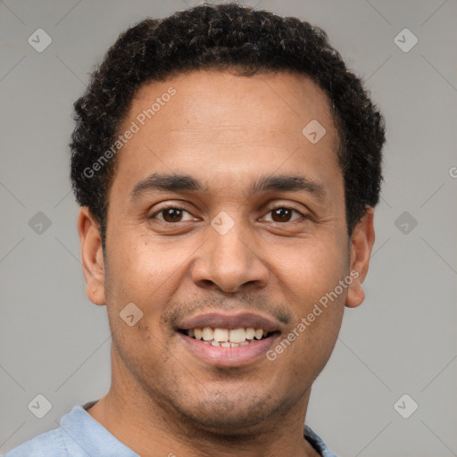 Joyful latino young-adult male with short  brown hair and brown eyes