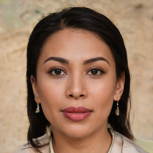 Joyful white young-adult female with medium  brown hair and brown eyes