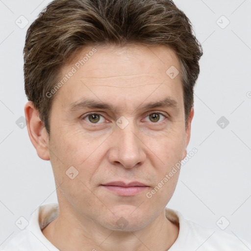 Joyful white adult male with short  brown hair and grey eyes