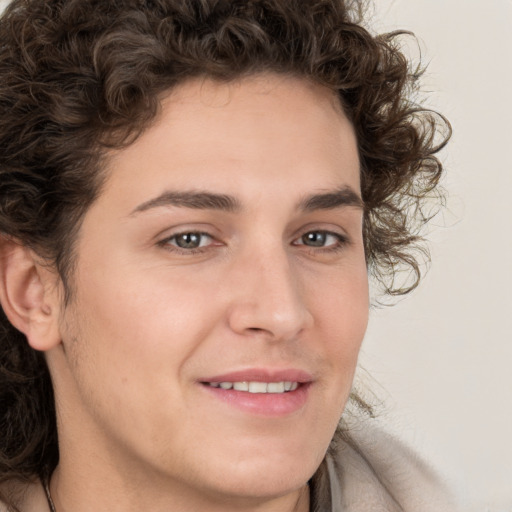 Joyful white young-adult male with medium  brown hair and brown eyes