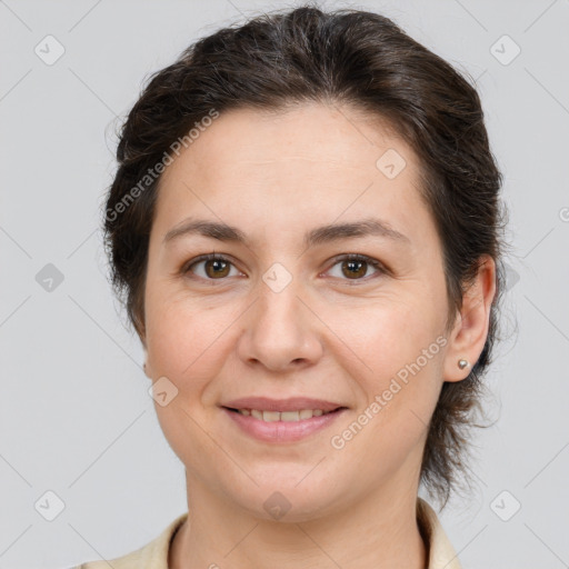 Joyful white adult female with medium  brown hair and brown eyes