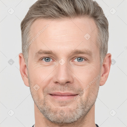 Joyful white adult male with short  brown hair and grey eyes