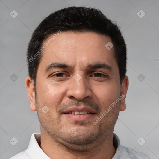 Joyful white adult male with short  brown hair and brown eyes