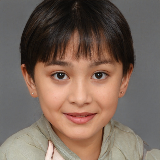 Joyful white child female with short  brown hair and brown eyes