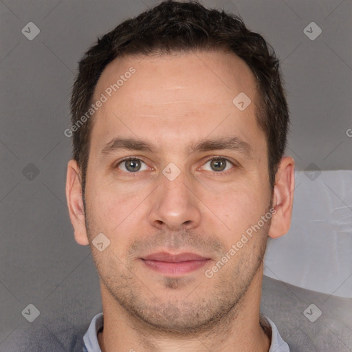 Joyful white adult male with short  brown hair and brown eyes