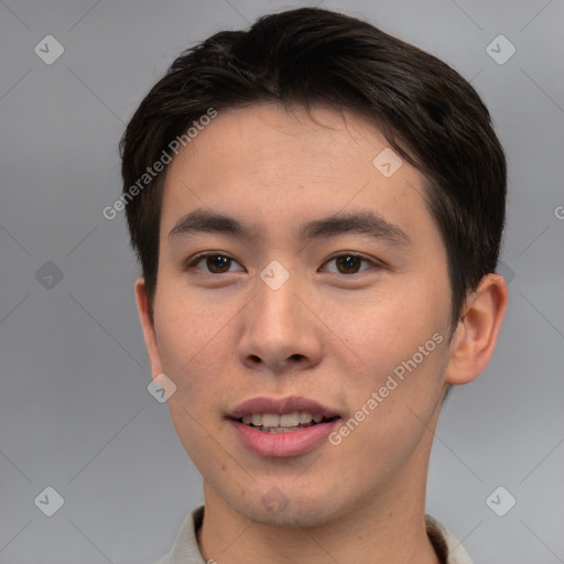 Joyful asian young-adult male with short  brown hair and brown eyes