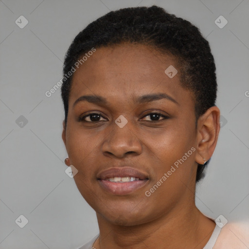 Joyful black young-adult female with short  black hair and brown eyes