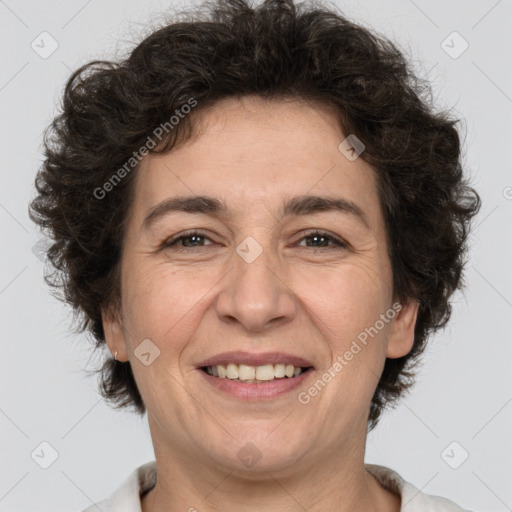 Joyful white adult female with short  brown hair and brown eyes