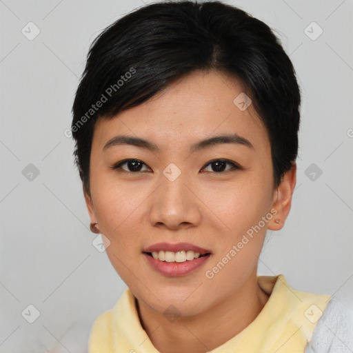 Joyful asian young-adult female with short  black hair and brown eyes