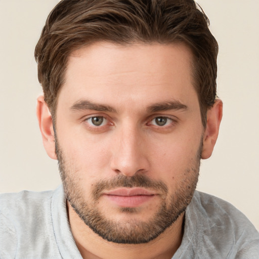 Joyful white young-adult male with short  brown hair and grey eyes