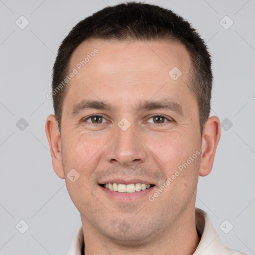 Joyful white adult male with short  brown hair and brown eyes