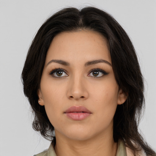 Neutral latino young-adult female with long  brown hair and brown eyes