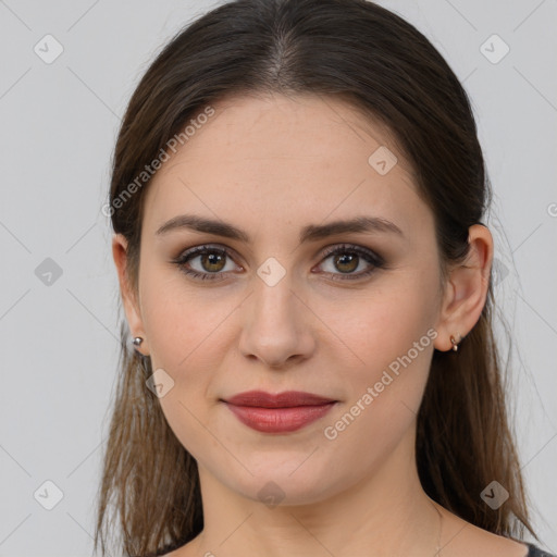 Joyful white young-adult female with medium  brown hair and grey eyes