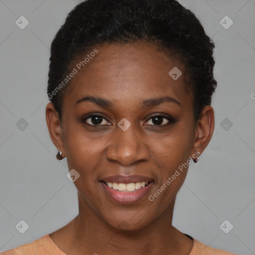 Joyful black young-adult female with short  black hair and brown eyes