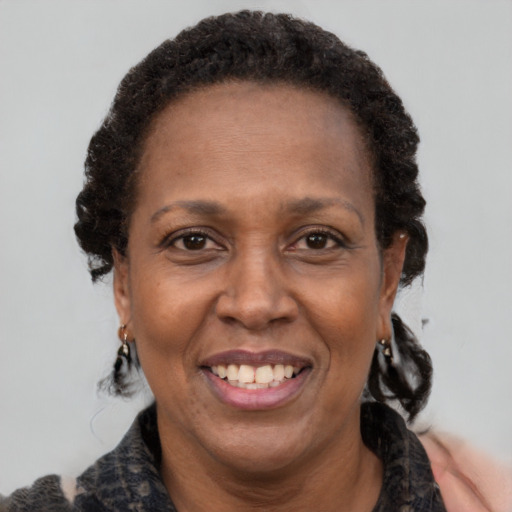 Joyful latino adult female with short  brown hair and brown eyes