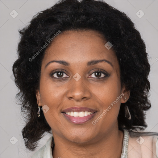 Joyful black young-adult female with long  brown hair and brown eyes