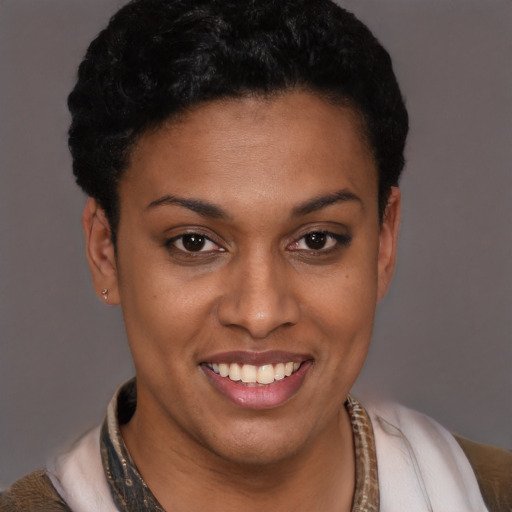 Joyful latino young-adult female with short  brown hair and brown eyes