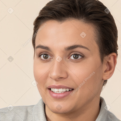 Joyful white young-adult female with short  brown hair and brown eyes