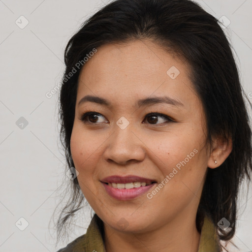 Joyful asian young-adult female with medium  brown hair and brown eyes