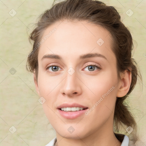 Joyful white young-adult female with medium  brown hair and green eyes