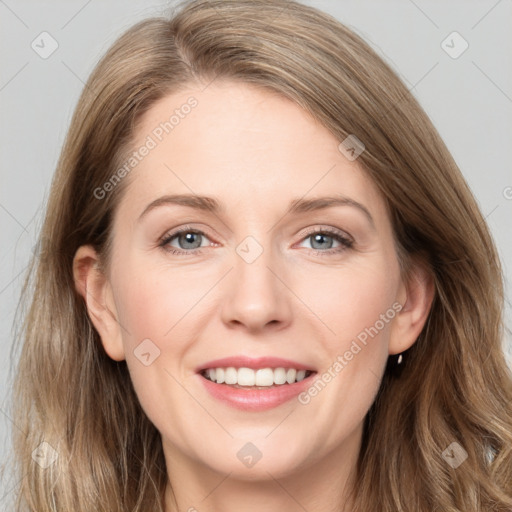 Joyful white young-adult female with long  brown hair and grey eyes