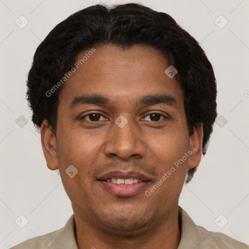 Joyful latino young-adult male with short  brown hair and brown eyes