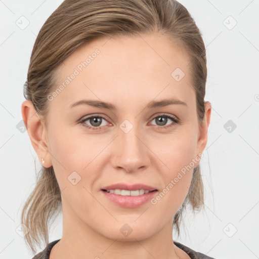 Joyful white young-adult female with medium  brown hair and grey eyes