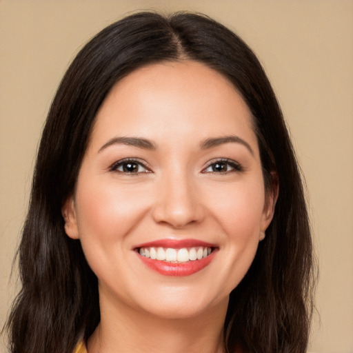 Joyful white young-adult female with long  brown hair and brown eyes