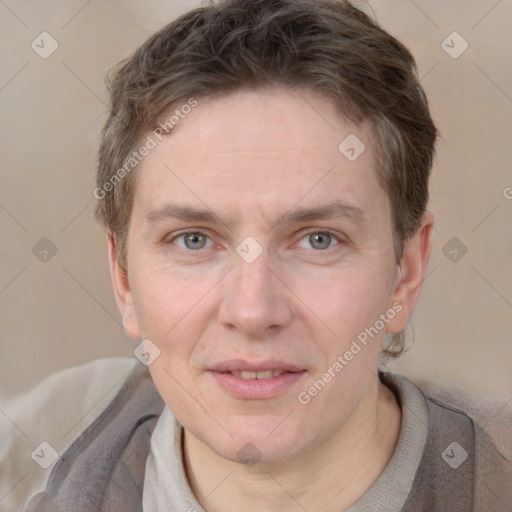 Joyful white adult male with short  brown hair and grey eyes