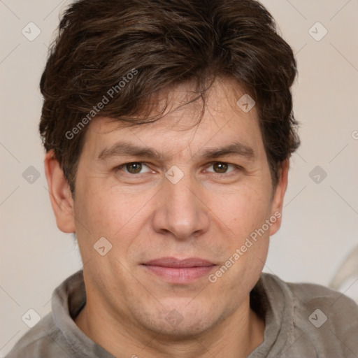 Joyful white adult male with short  brown hair and grey eyes