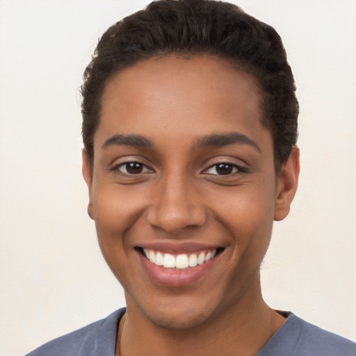 Joyful latino young-adult female with short  brown hair and brown eyes