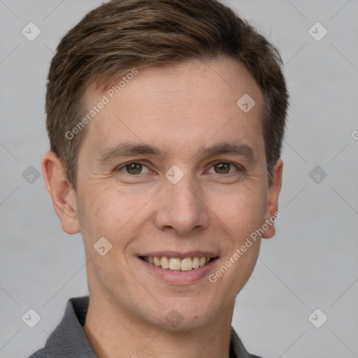 Joyful white adult male with short  brown hair and grey eyes