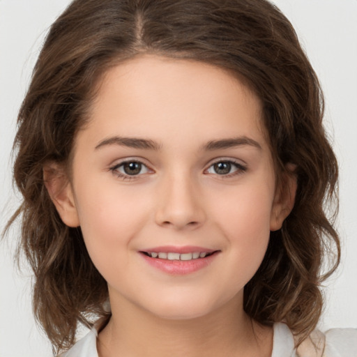 Joyful white child female with medium  brown hair and brown eyes