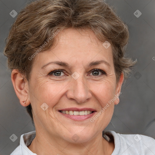 Joyful white adult female with short  brown hair and grey eyes