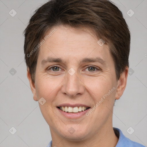 Joyful white adult female with short  brown hair and brown eyes