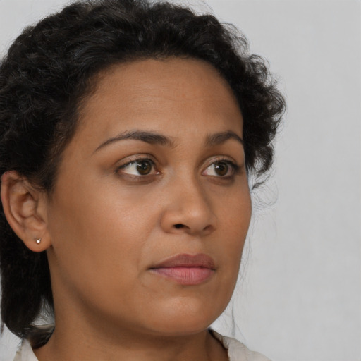 Neutral latino young-adult female with short  brown hair and brown eyes