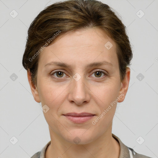 Joyful white adult female with short  brown hair and grey eyes