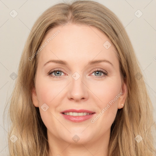 Joyful white adult female with long  brown hair and grey eyes