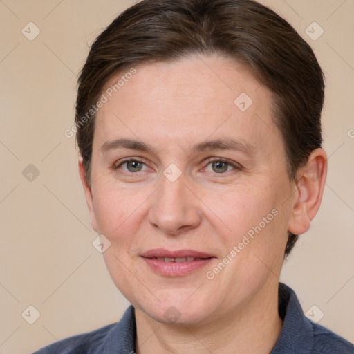 Joyful white adult female with short  brown hair and grey eyes