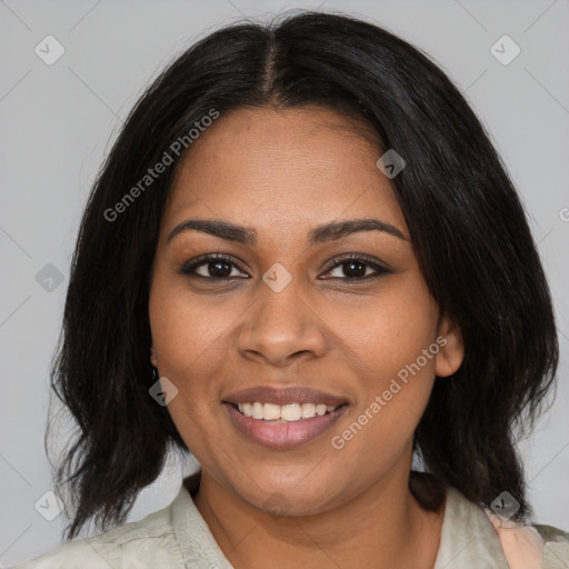 Joyful black adult female with medium  black hair and brown eyes