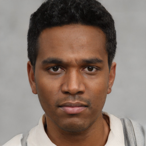 Neutral black young-adult male with short  black hair and brown eyes