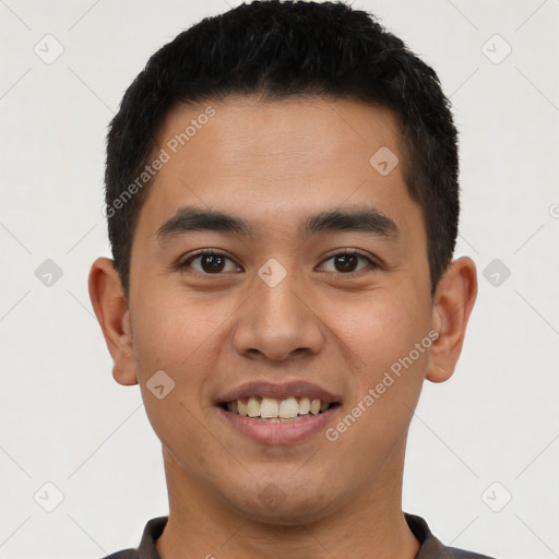 Joyful latino young-adult male with short  black hair and brown eyes