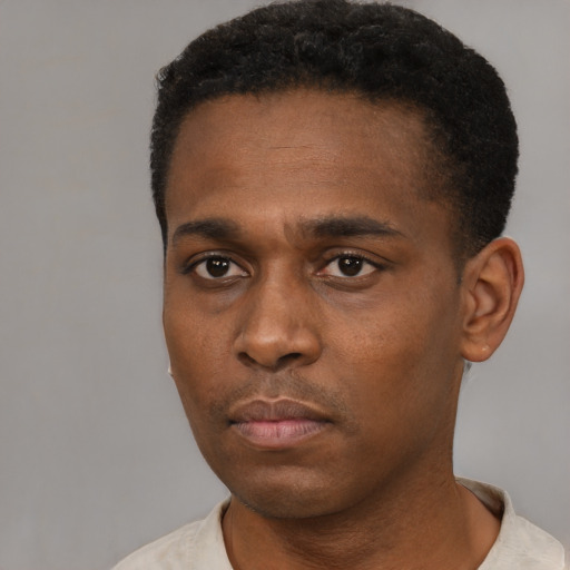 Neutral black young-adult male with short  black hair and brown eyes