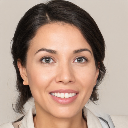 Joyful white young-adult female with medium  brown hair and brown eyes