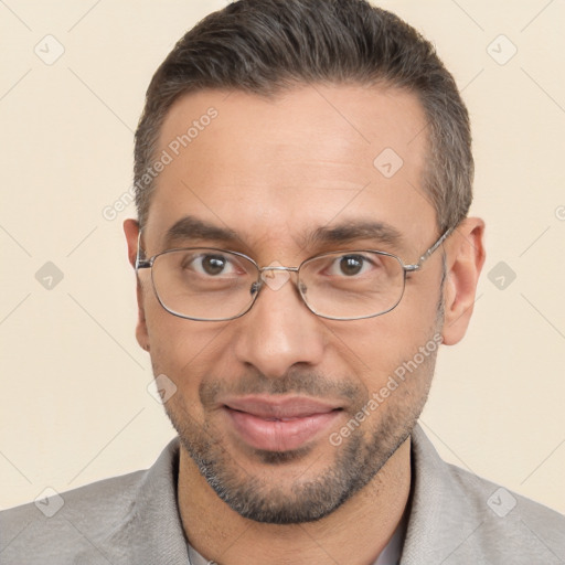 Joyful white adult male with short  brown hair and brown eyes