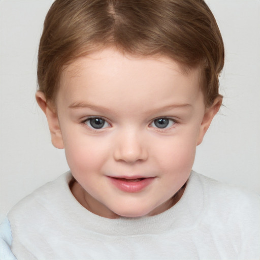 Joyful white child female with short  brown hair and brown eyes