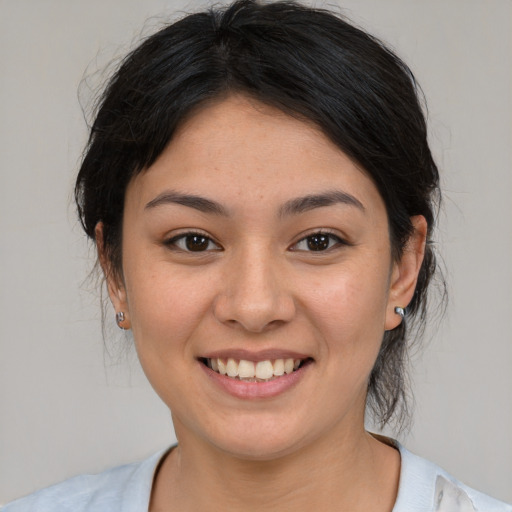 Joyful asian young-adult female with medium  brown hair and brown eyes